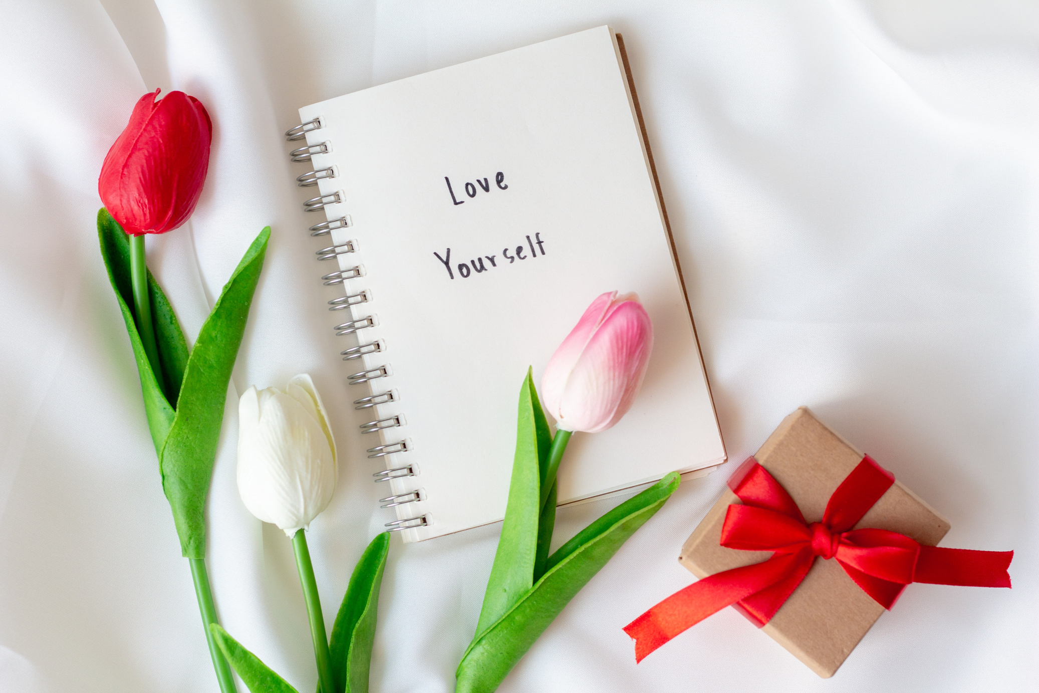 Notebook with Love Yourself Text and Tulip Flowers 
